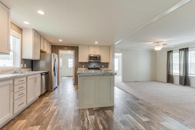 575 Gallery Dr Unit 48, Eaton Rapids, MI 48827 - kitchen with stainless steel appliances, healthy amount of natural light, a kitchen island, wood finished floors, and recessed lighting