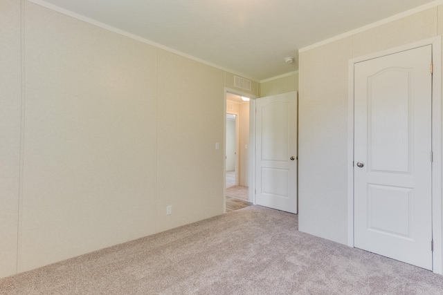 575 Gallery Dr Unit 48, Eaton Rapids, MI 48827 - unfurnished bedroom with carpet flooring and crown molding