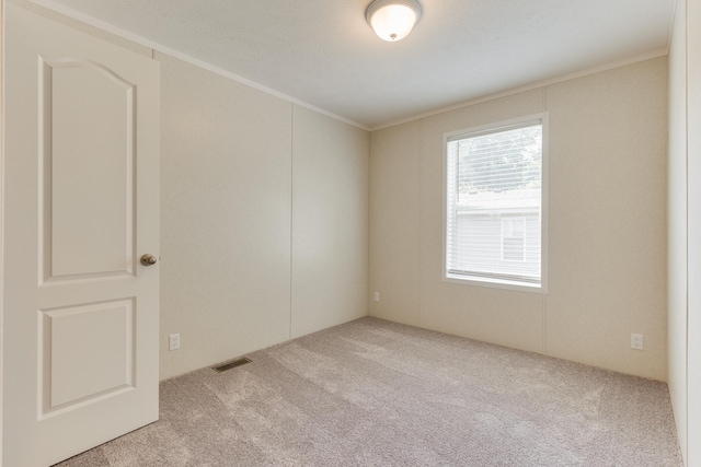 575 Gallery Dr Unit 48, Eaton Rapids, MI 48827 - carpeted spare room featuring crown molding