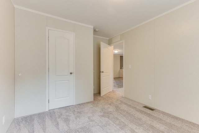 575 Gallery Dr Unit 48, Eaton Rapids, MI 48827 - empty room with carpet floors and crown molding