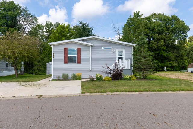 575 Gallery Dr Unit 48, Eaton Rapids, MI 48827 - view of front of property featuring a front lawn