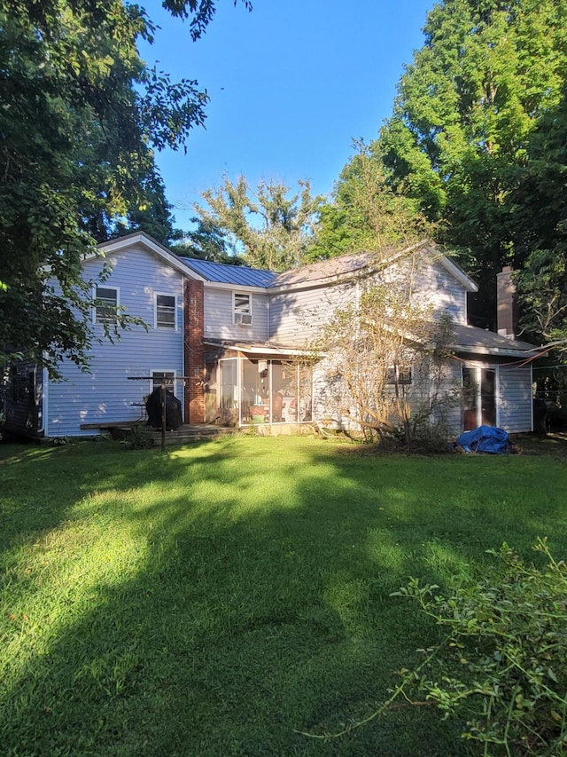 view of yard featuring a sunroom