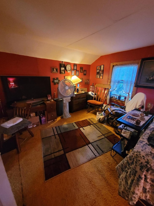 living room with carpet floors and vaulted ceiling