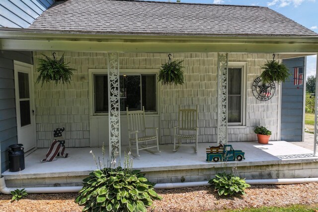 doorway to property featuring a porch