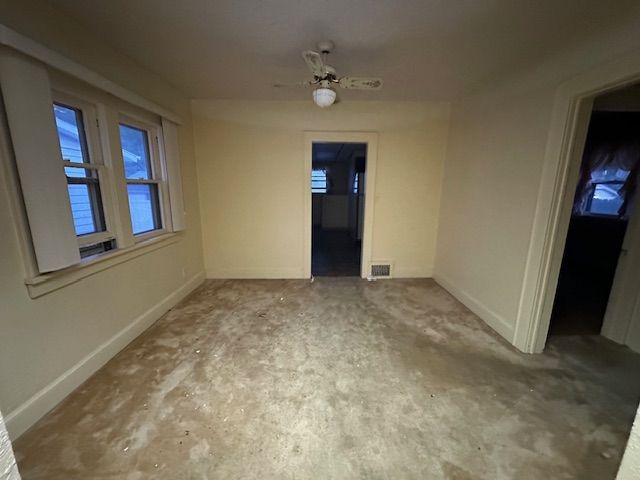 unfurnished room featuring ceiling fan