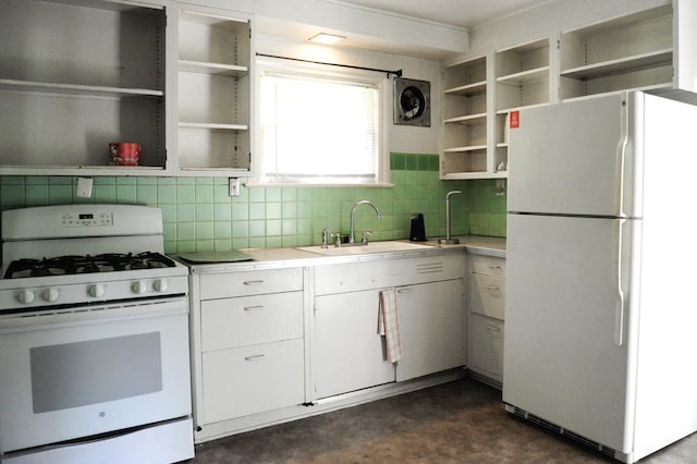 kitchen featuring decorative backsplash, white cabinetry, sink, and white appliances