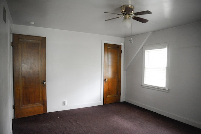 unfurnished bedroom featuring ceiling fan and carpet