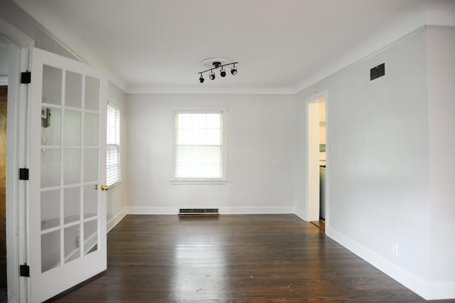 unfurnished room with dark wood-type flooring