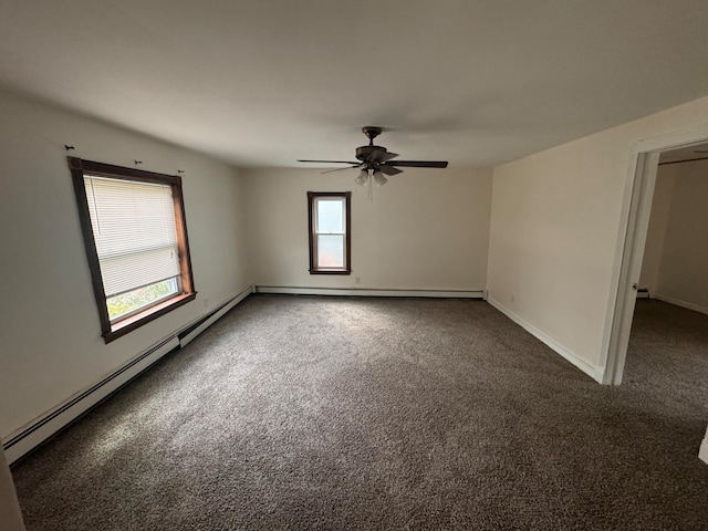 unfurnished room featuring ceiling fan, dark carpet, and baseboard heating