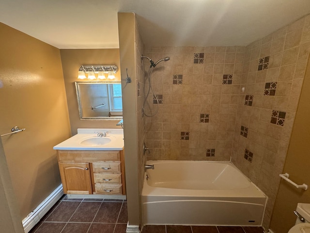 full bathroom with tile patterned flooring, vanity, tiled shower / bath combo, and toilet