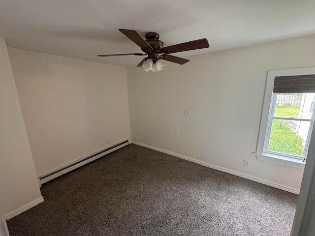 carpeted spare room with a baseboard radiator and ceiling fan