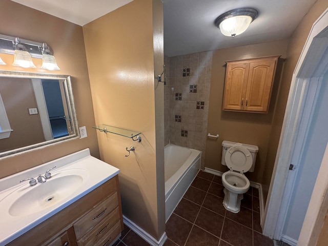 full bathroom featuring tile patterned flooring, vanity, tiled shower / bath combo, and toilet