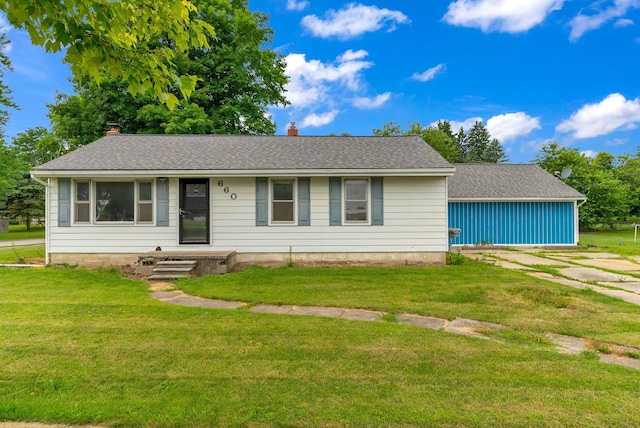 ranch-style home with a front lawn