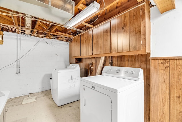 clothes washing area featuring separate washer and dryer