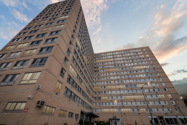 view of outdoor building at dusk