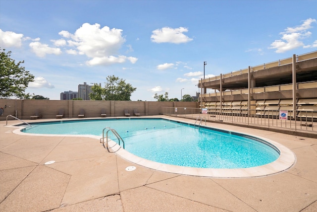 view of swimming pool featuring a patio area