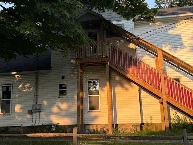 view of side of property featuring a balcony