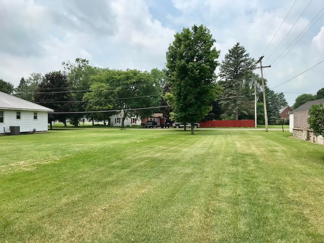 view of yard with central air condition unit