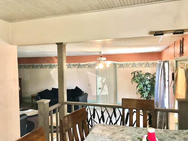 interior space with ceiling fan