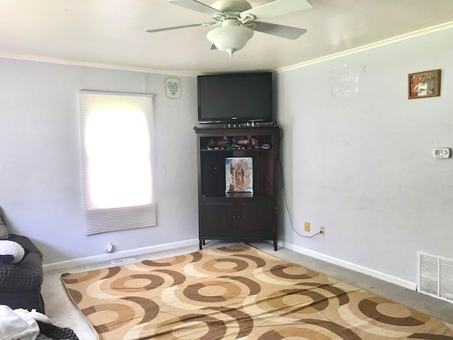 bedroom featuring light colored carpet, ceiling fan, and ornamental molding