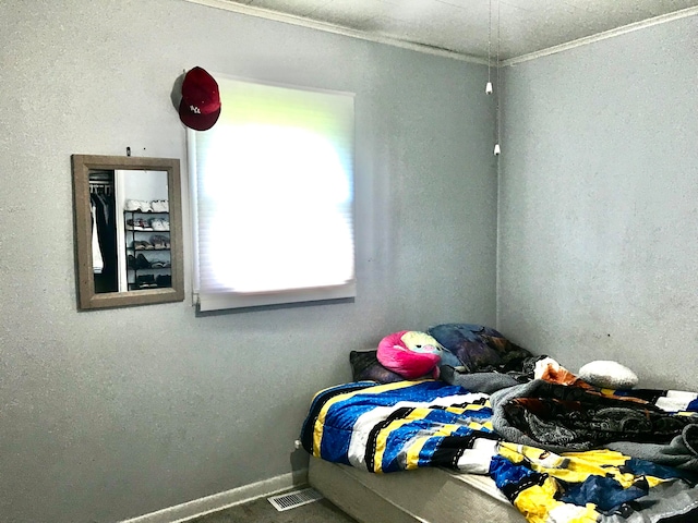 bedroom with ornamental molding