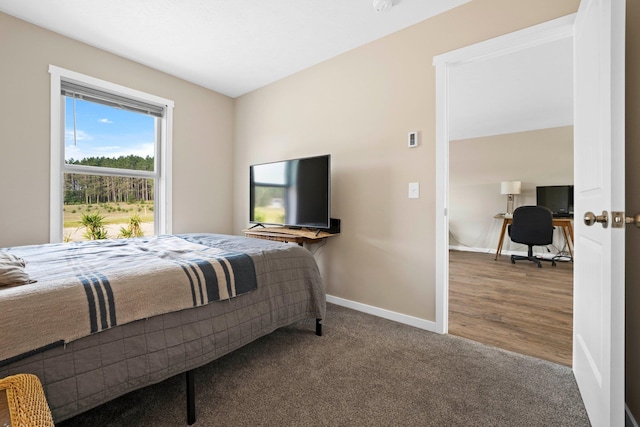 bedroom with hardwood / wood-style flooring