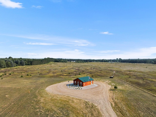 birds eye view of property with a rural view