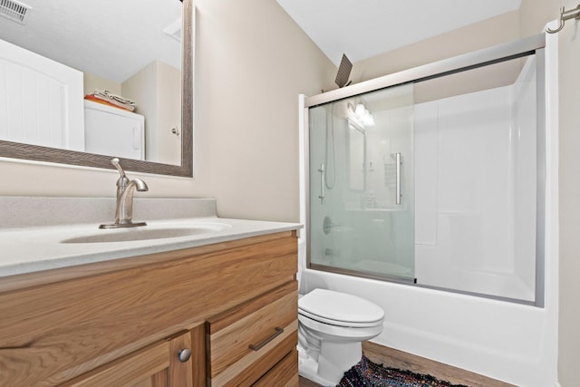 full bathroom with toilet, vanity, bath / shower combo with glass door, and hardwood / wood-style flooring