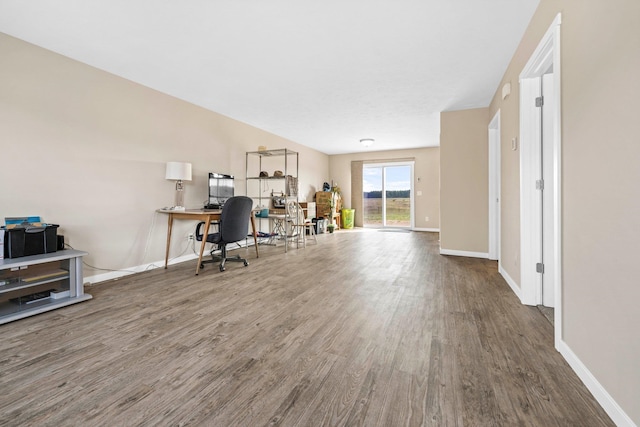 home office with dark wood-type flooring