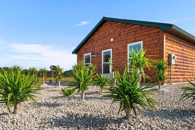 2835 Walton Rd, Kingsley, MI 49649 - view of side of home with log veneer siding