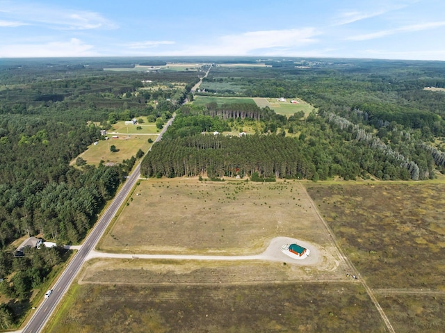 birds eye view of property with a rural view