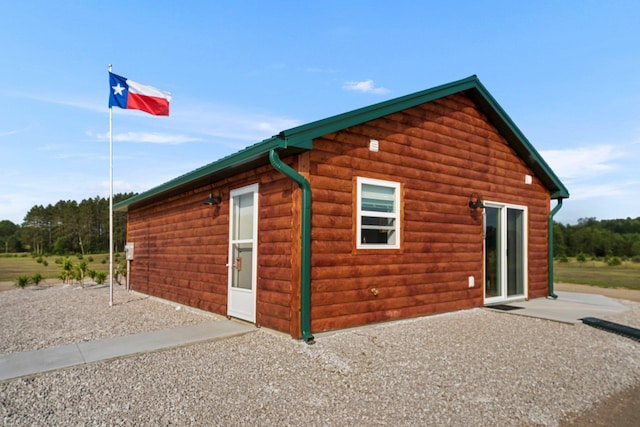 view of side of home featuring a patio