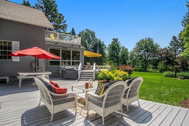 5925 Jagger Rd, Ludington, MI 49431 - deck with outdoor dining space and a yard