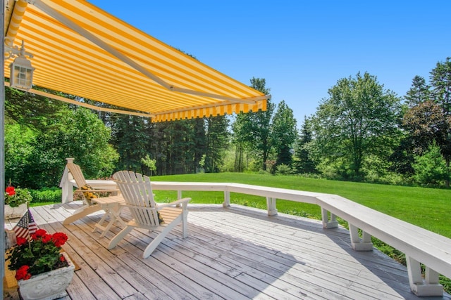 5925 Jagger Rd, Ludington, MI 49431 - deck with a lawn and view of wooded area