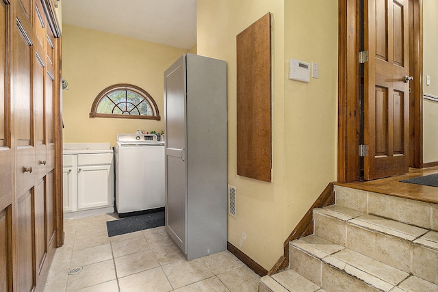 5925 Jagger Rd, Ludington, MI 49431 - laundry room featuring washer / clothes dryer and light tile patterned floors