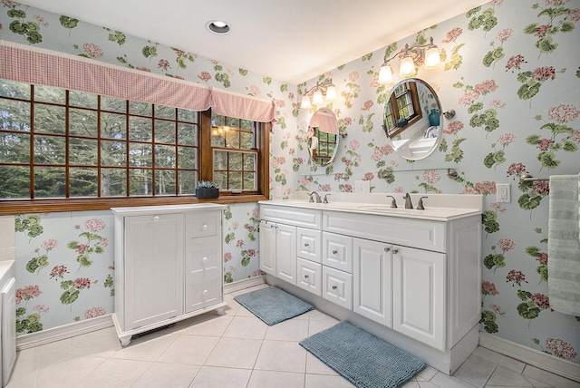 5925 Jagger Rd, Ludington, MI 49431 - full bath with double vanity, wallpapered walls, and tile patterned flooring