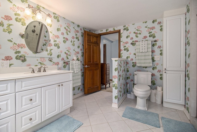 5925 Jagger Rd, Ludington, MI 49431 - bathroom with wallpapered walls, vanity, and tile patterned floors