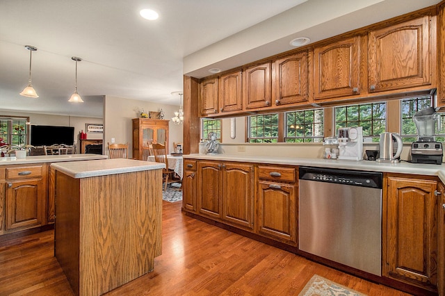 5925 Jagger Rd, Ludington, MI 49431 - kitchen with dishwasher, brown cabinets, dark wood finished floors, and recessed lighting