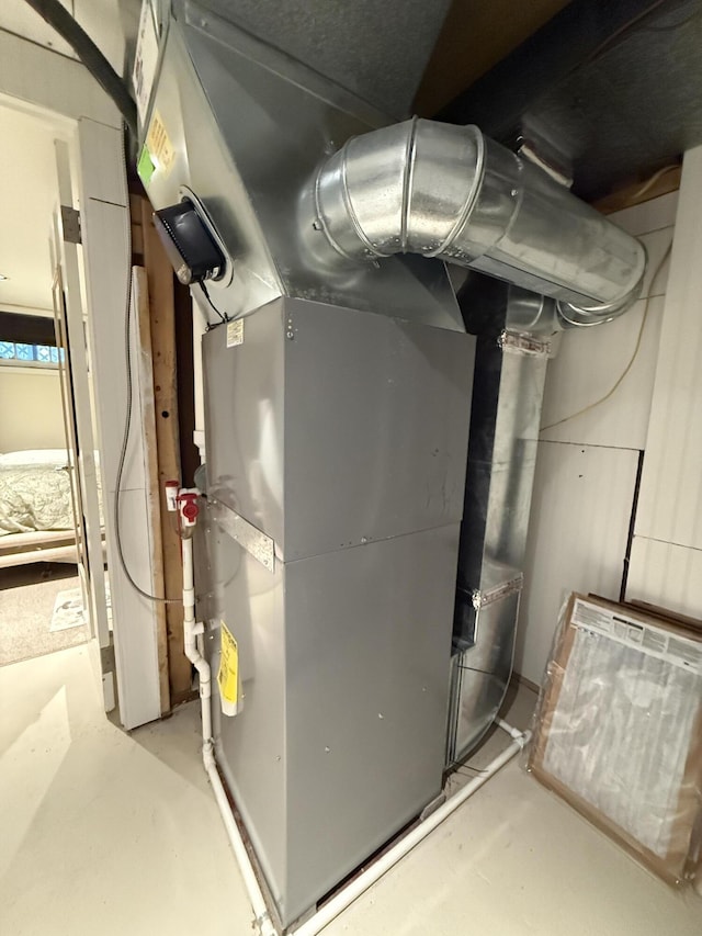 5925 Jagger Rd, Ludington, MI 49431 - utility room with heating unit