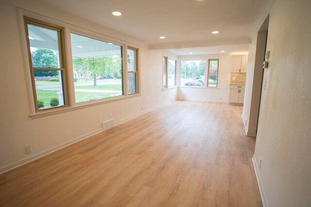 unfurnished living room with light wood-type flooring