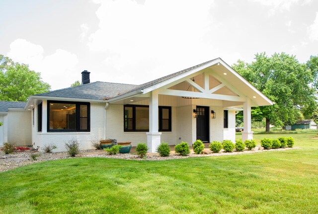 view of front of home with a front yard