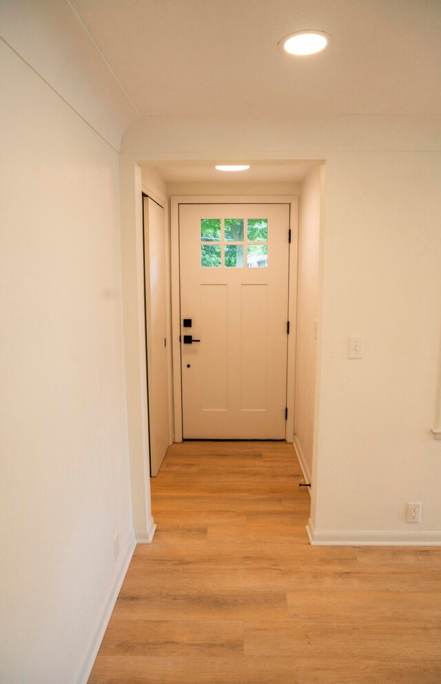 doorway to outside with light hardwood / wood-style flooring