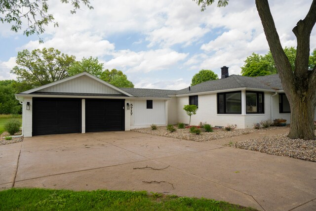 ranch-style house featuring a garage