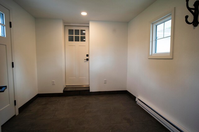 interior space featuring a baseboard heating unit