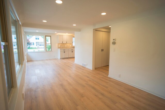 unfurnished living room featuring light hardwood / wood-style floors