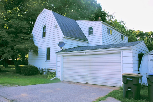 garage with a lawn