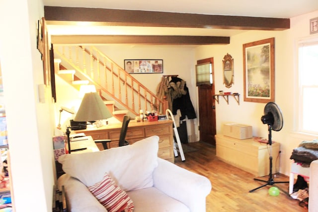 interior space featuring beamed ceiling and hardwood / wood-style flooring