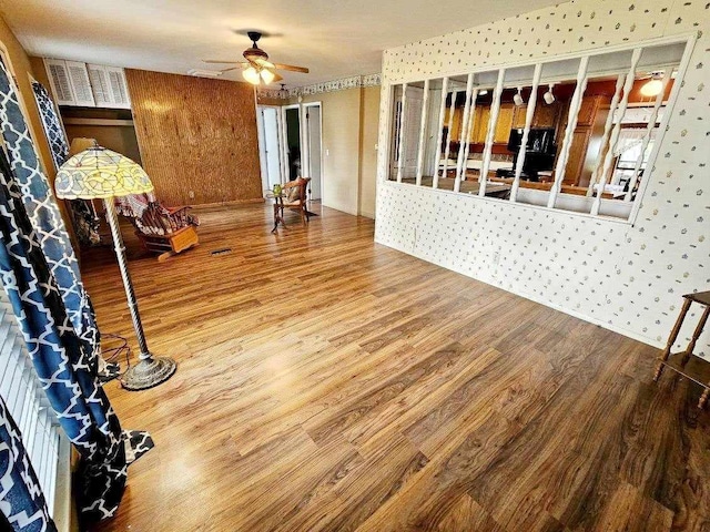 interior space featuring ceiling fan and wood-type flooring