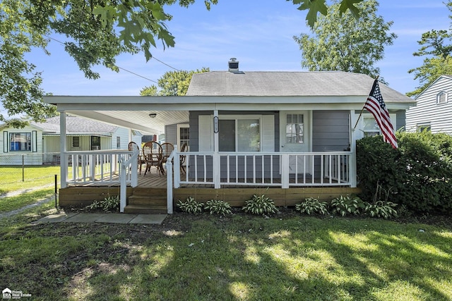 1029 Boatfield Ave, Flint, MI 48507 - view of front of home featuring covered porch, roof with shingles, and a chimney