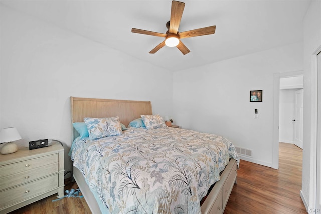 bedroom featuring dark hardwood / wood-style floors and ceiling fan